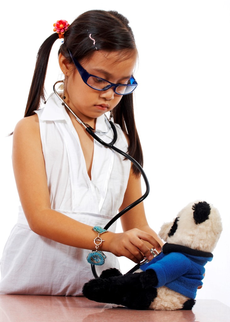 Girl Playing At Being A Doctor